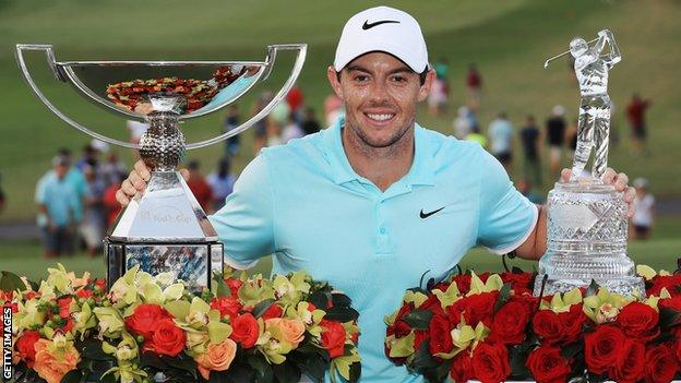 Rory McIlroy with the Tour Championship and FedEx Cup trophies