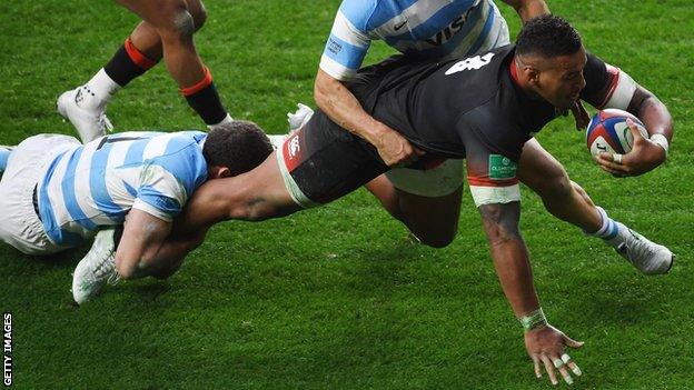 Nathan Hughes powers over to score for England against Argentina