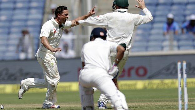 Steve O'Keefe celebrates bowling India captain Virat Kohli