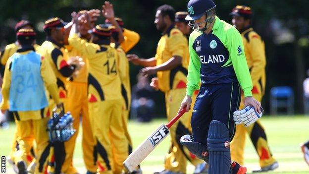 Papua New Guinea celebrate taking the wicket of Gary Wilson