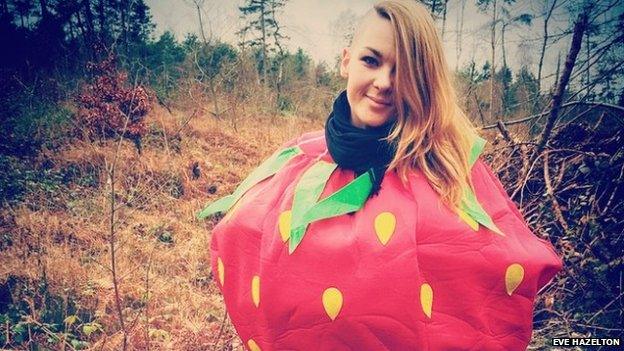 Eve dressed as a strawberry