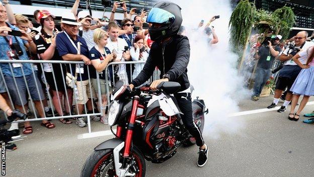 Lewis Hamilton entertains the fans at the Red Bull Ring before third practice