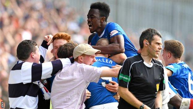 Rangers fans spill onto the pitch to celebrate with players after their injury-time winner against Partick