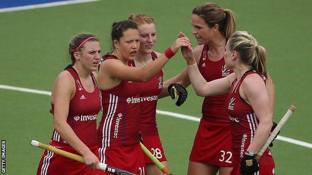 Great Britain team-mates congratulate Nicola White on the opening goal against South Korea