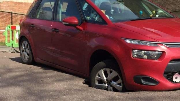 Car in sink hole, Norwich