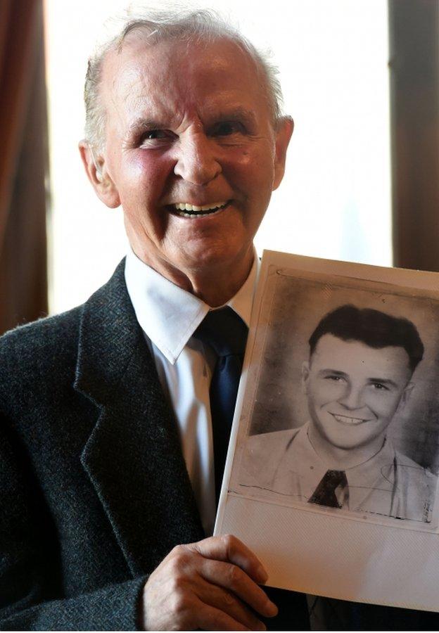 Roy Clark with a photo of his brother Private Archibald Buchanan Clark who was killed in the Korean War