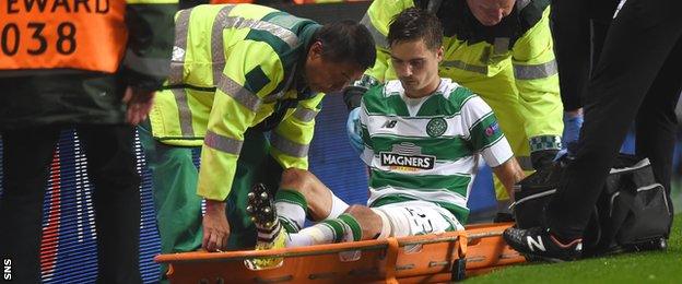 Celtic defender Mikael Lustig is stretchered off and may miss the return leg in Sweden