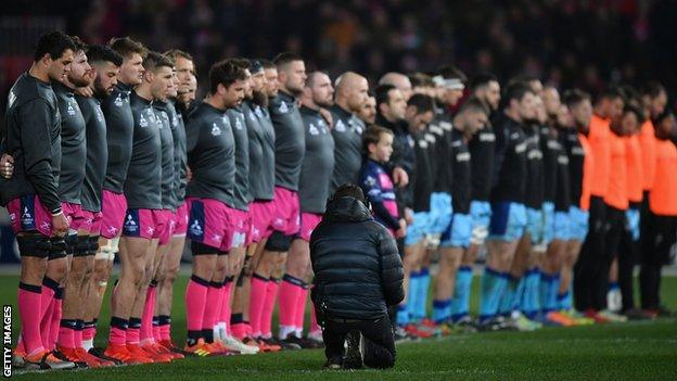 Gloucester and Exeter players observe a minute's silence in memory of dead Stade Francais youth player Nicolas Chauvin before their Champions Cup match