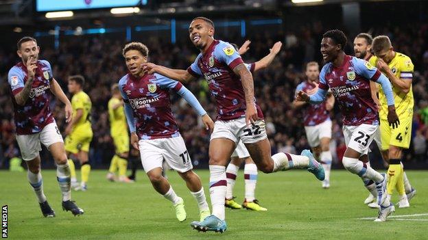 Burnley's Vitinho (centre) celebrates scoring their side's first goal against Burnley