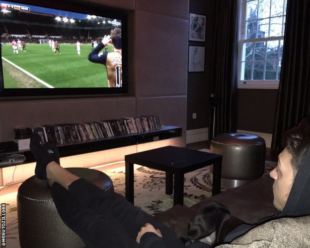 Mesut Ozil in his living room