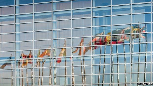 All European Union member countries flags reflected in European Parliament facade in Strasbourg, France