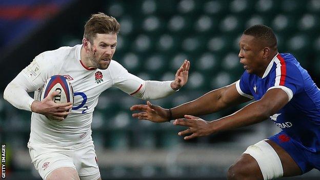 Elliot Daly hands off France's Cameron Woki