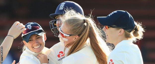 Sophie Ecclestone (centre) celebrates a wicket in 2017