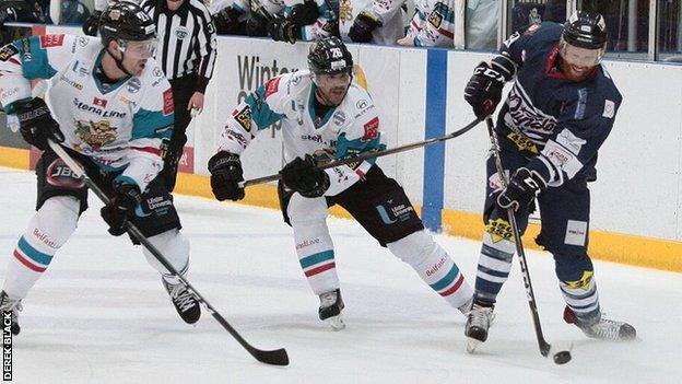 Giants pair Jonathan Ferland and Brandon Benedict close in on a Dundee opponent