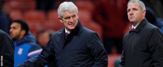 Mark Hughes leaves the pitch