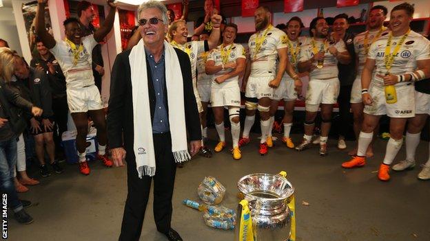 Nigel Wray in the Saracens dressing room with the Premiership trophy