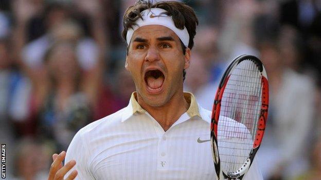 Roger Federer jumps into the air after winning the 2009 title at Wimbledon