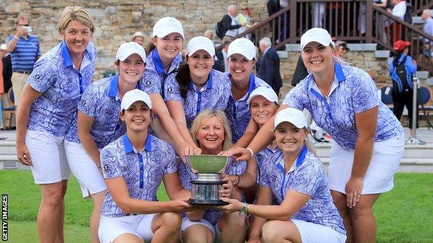 The Great Britain and Ireland team celebrate with the Curtis Cup trophy in 2016