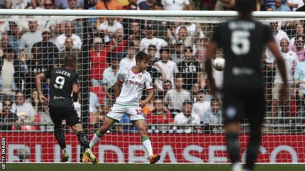 Michael Cheek scores for Bromley against Wrexham.