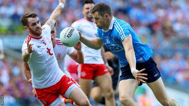 Tyrone's Ronan McNamee attempts to halt the progress of Dublin's Dean Rock