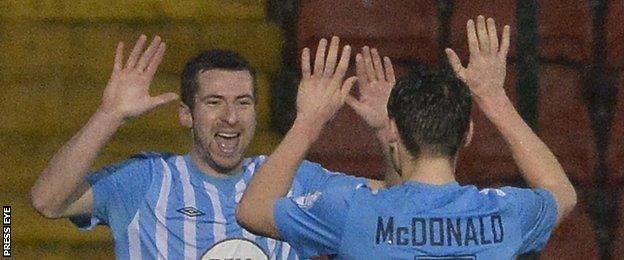 Stephen Murray celebrates with Conor McDonald after hitting Warrenpoint's equaliser at Solitude