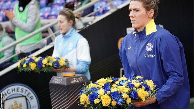 Manchester City's Ellen White and Chelsea's Millie Bright carry wreaths on the pitch before the Women's Continental Cup final