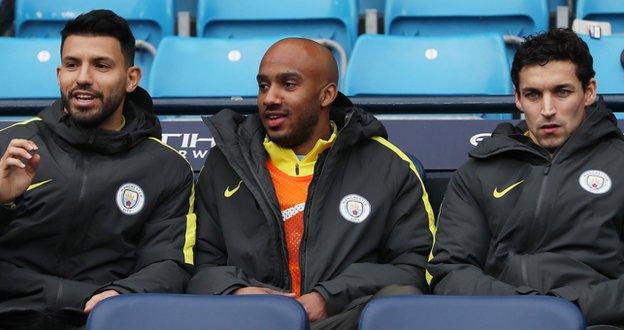 Aguero (l) on the Man City bench