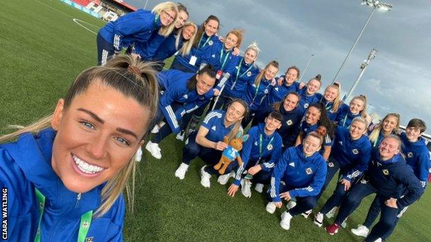 Northern Ireland take a team selfie on the pitch