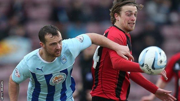 Andy Webster (left) in action for Coventry City