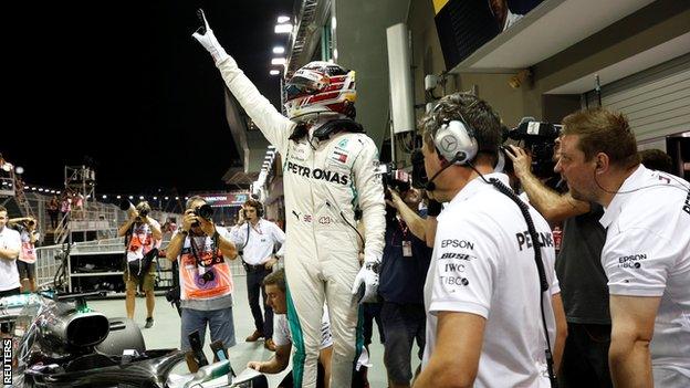 Lewis Hamilton celebrates after the qualifying session at the Singapore Grand Prix