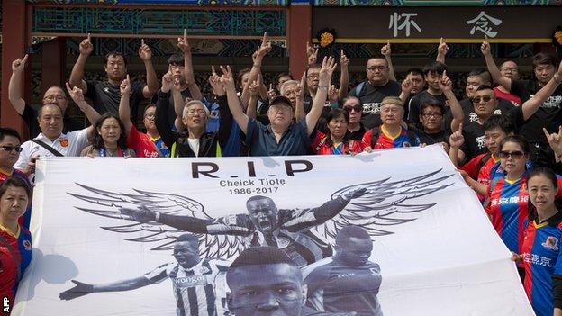 A banner paying tribute to Cheick Tiote at his memorial service