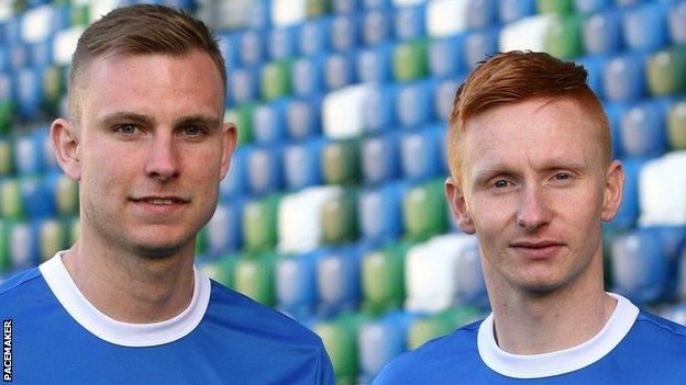 Andrew Mitchell and Robert Garrett have signed for champions Linfield