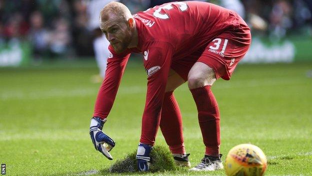 Ross County goalkeeper Aaron McCarey