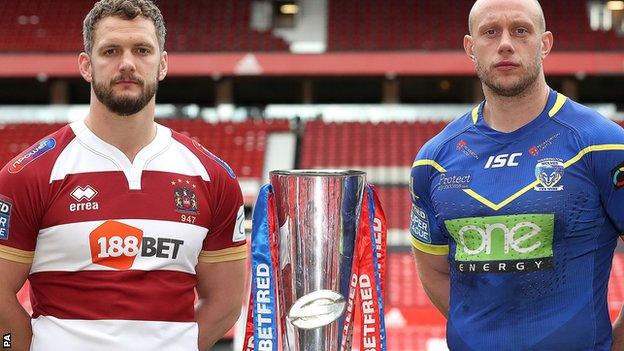 Wigan captain Sean O'Loughlin and Warrington's Chris Hill with the Super League trophy at Old Trafford