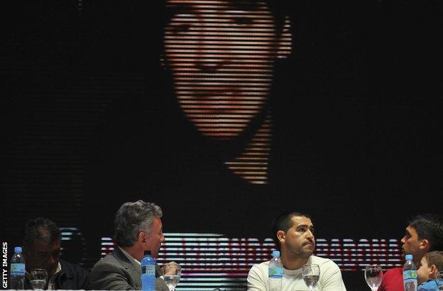 Diego Maradona addresses a press conference by video link