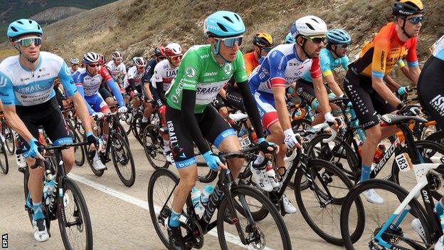 Daniel Martin (centre) attacks on stage three