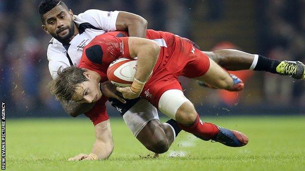 Liam Williams is tackled by Nikola Matawalu at the Millennium Stadium in November 2014