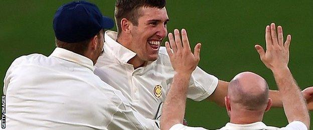 Craig Overton celebrates during his hat-trick