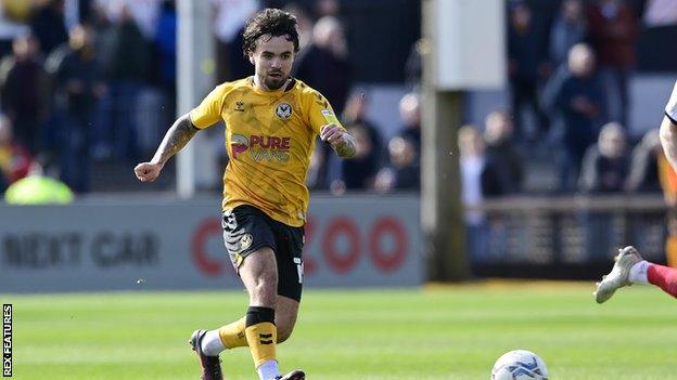 Forward Dom Telford playing for Newport County