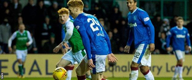 David Bates controls a Hibs cross with his left arm