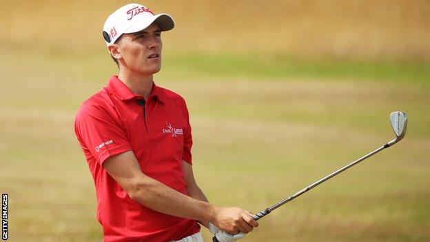 Sam Locke watching his ball having played an iron shot