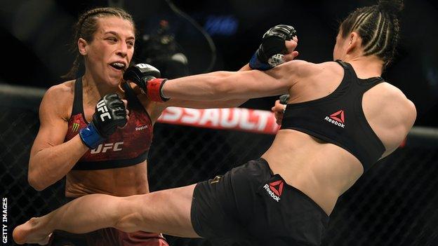 Joanna Jedrzejczyk and Zhang Weili fighting at UFC 248