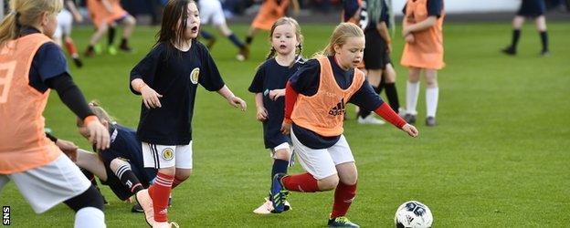 Young kids playing football at Hampden