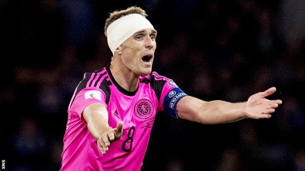 Darren Fletcher makes a point playing for Scotland against Slovakia last October