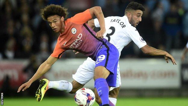 Neil Taylor (seen here in action against Manchester City in the League Cup third round) has also won 35 caps for Wales