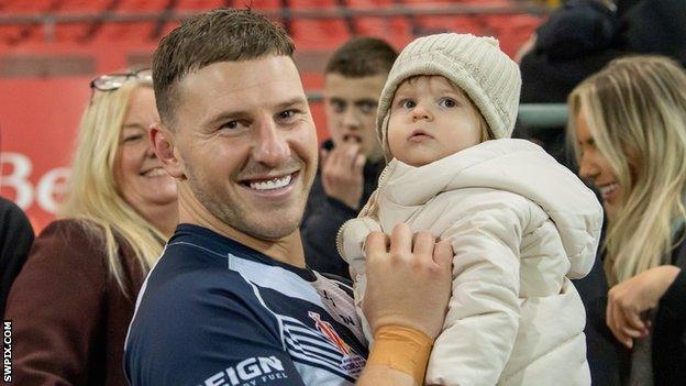 George Williams with daughter Pearl after the game