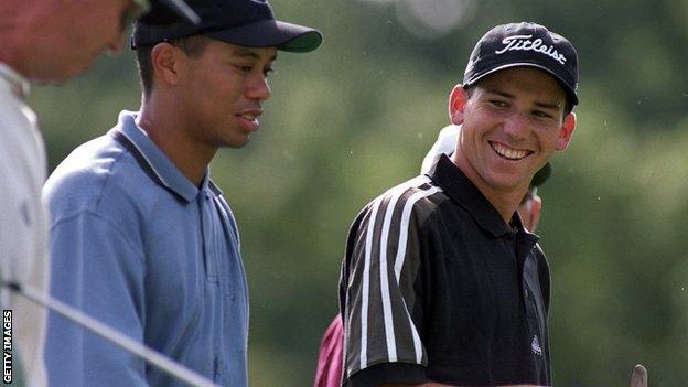 Tiger Woods and Sergio Garcia, talking as they walk up fairway