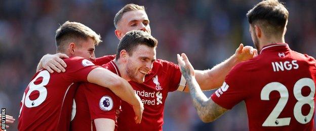 Andrew Robertson celebrates with his Liverpool team-mates