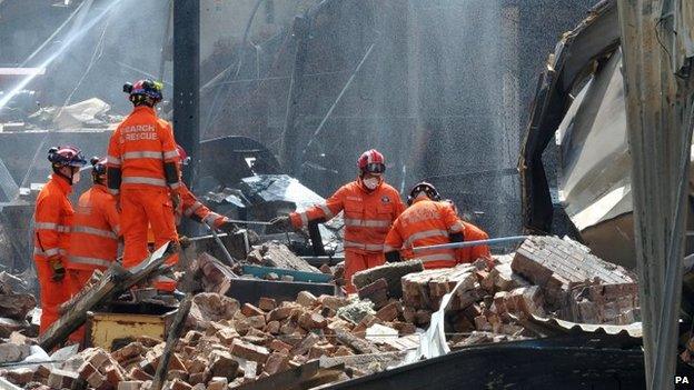 A rescue team searches the Bosley explosion site