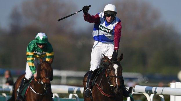 Jockey Derek Fox rides One for Arthur (C) to win the Grand National